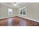 Bright bedroom with hardwood floors and large windows at 951 Cedar St, Rock Hill, SC 29730