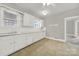 Bright kitchen features white cabinets and tile floor at 951 Cedar St, Rock Hill, SC 29730