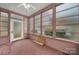 Sunroom features terracotta tile floor and multiple windows at 951 Cedar St, Rock Hill, SC 29730