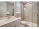 Well-lit bathroom featuring a glass-enclosed shower, a modern vanity, and a bright, airy atmosphere at 9831 Quercus Ln, Huntersville, NC 28078