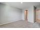 Bedroom with carpet flooring and neutral walls, providing a blank canvas for personalization at 9831 Quercus Ln, Huntersville, NC 28078