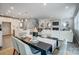 Open concept dining room with view of modern living room and staircase at 9831 Quercus Ln, Huntersville, NC 28078