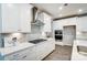 Modern kitchen featuring stainless steel appliances, gas stove, and ample counter space with decorative lighting at 9831 Quercus Ln, Huntersville, NC 28078