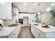 Modern kitchen featuring a large island with seating, stainless steel appliances, and ample counter space at 9831 Quercus Ln, Huntersville, NC 28078