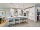 Bright, modern kitchen featuring a large island with seating, stainless steel appliances, and ample cabinet space at 9831 Quercus Ln, Huntersville, NC 28078