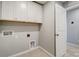 A laundry room with hookups and built-in cabinets at 9831 Quercus Ln, Huntersville, NC 28078