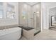 Bathroom with a free-standing bathtub and a walk-in shower with glass door at 11112 Benjamin Smith Ave, Huntersville, NC 28078