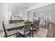 Bright dining room features a large wooden table with seating for six and a view into the kitchen at 11112 Benjamin Smith Ave, Huntersville, NC 28078