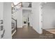 Bright entryway with hardwood floors, staircase, and views to living room at 11112 Benjamin Smith Ave, Huntersville, NC 28078