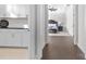 Hallway view of laundry room and main bedroom with hardwood floors at 11112 Benjamin Smith Ave, Huntersville, NC 28078