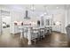 Modern kitchen with white cabinets, center island, and stainless steel appliances at 11112 Benjamin Smith Ave, Huntersville, NC 28078