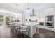Modern kitchen with white cabinets, large island, and stainless steel appliances at 11112 Benjamin Smith Ave, Huntersville, NC 28078