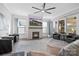 Spacious living room with fireplace, large windows, and seating area at 11112 Benjamin Smith Ave, Huntersville, NC 28078