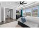 Main bedroom with hardwood floors, large windows, and a view of the hallway at 11112 Benjamin Smith Ave, Huntersville, NC 28078
