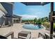 Inviting kidney-shaped pool with stone patio and surrounding landscaping at 11112 Benjamin Smith Ave, Huntersville, NC 28078