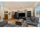 Living room with gray sofas and built-in shelving at 11900 Musket Ln, Charlotte, NC 28273