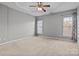 Bright bedroom with neutral walls and carpet flooring at 121 Beverly Chase Ln, Mooresville, NC 28117