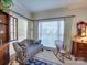 Relaxing sitting room with a window seat and built-in shelving at 125 Musketball Ct, Indian Trail, NC 28079