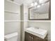 The bathroom features a wood vanity sink and a large mirror with a decorative wooden frame at 132 30Th Nw Ave, Hickory, NC 28601