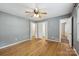 Cozy bedroom with hardwood floors, ceiling fan, and ample closet space at 132 30Th Nw Ave, Hickory, NC 28601