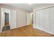 This bedroom features hardwood floors and double door closets for ample storage space at 132 30Th Nw Ave, Hickory, NC 28601