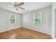 Bright bedroom with hardwood floors, a ceiling fan, and natural light at 132 30Th Nw Ave, Hickory, NC 28601