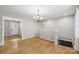 Open dining area with hardwood floors, chandelier, and seamless transition to other rooms at 132 30Th Nw Ave, Hickory, NC 28601