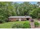 Traditional brick ranch-style home with a manicured lawn and classic architectural details at 132 30Th Nw Ave, Hickory, NC 28601
