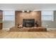 The living room highlights a brick fireplace with a wood-burning stove as its focal point at 132 30Th Nw Ave, Hickory, NC 28601