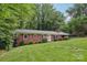 Charming brick home featuring a lush green lawn and inviting curb appeal at 132 30Th Nw Ave, Hickory, NC 28601