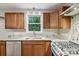 Open kitchen showcases granite countertops, stainless appliances, and natural light with a window view at 132 30Th Nw Ave, Hickory, NC 28601