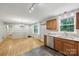 Well-lit kitchen and dining area featuring stainless steel appliances and granite countertops at 132 30Th Nw Ave, Hickory, NC 28601