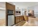 This kitchenette offers wooden cabinets, a sink, a microwave, and a small refrigerator at 132 30Th Nw Ave, Hickory, NC 28601