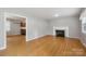 Spacious living area featuring hardwood floors and a view into the kitchen at 132 30Th Nw Ave, Hickory, NC 28601