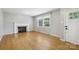 Bright living room with hardwood floors, a cozy fireplace, and natural light at 132 30Th Nw Ave, Hickory, NC 28601