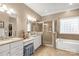 Elegant bathroom with double vanity, soaking tub, and shower at 157 Highland Forest Dr, Clover, SC 29710