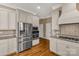 Kitchen features stainless steel appliances and ample off-white cabinetry at 157 Highland Forest Dr, Clover, SC 29710