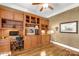 Home office with built-in shelving and hardwood floors at 157 Highland Forest Dr, Clover, SC 29710