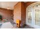Sunroom with brick walls, tile floor and French doors at 157 Highland Forest Dr, Clover, SC 29710