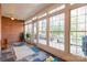Sunroom with brick wall, tile flooring and access to deck at 157 Highland Forest Dr, Clover, SC 29710
