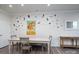 Dining area with table and chairs, sunflower art, and bird wall decals at 18106 Pear Hawthorne Dr, Huntersville, NC 28078