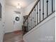 Entryway with staircase, coat rack, and decorative rug at 18106 Pear Hawthorne Dr, Huntersville, NC 28078