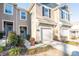 Beige townhome with front door, walkway, and landscaping at 18106 Pear Hawthorne Dr, Huntersville, NC 28078