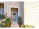 Townhome's front entrance with wreath and welcome mat at 18106 Pear Hawthorne Dr, Huntersville, NC 28078