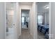 Hallway with access to bathroom, bedroom, and additional rooms at 18106 Pear Hawthorne Dr, Huntersville, NC 28078