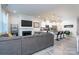 Living room with fireplace, sectional sofa, and hardwood floors at 18106 Pear Hawthorne Dr, Huntersville, NC 28078