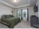 Spacious main bedroom with large bed and dresser at 18106 Pear Hawthorne Dr, Huntersville, NC 28078