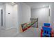 Upstairs landing with built-in shelving and a staircase at 18106 Pear Hawthorne Dr, Huntersville, NC 28078