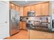 Kitchen with stainless steel appliances and wood cabinets at 18123 Coulter Pkwy, Cornelius, NC 28031