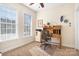 Home office with built-in desk and plenty of natural light at 18123 Coulter Pkwy, Cornelius, NC 28031